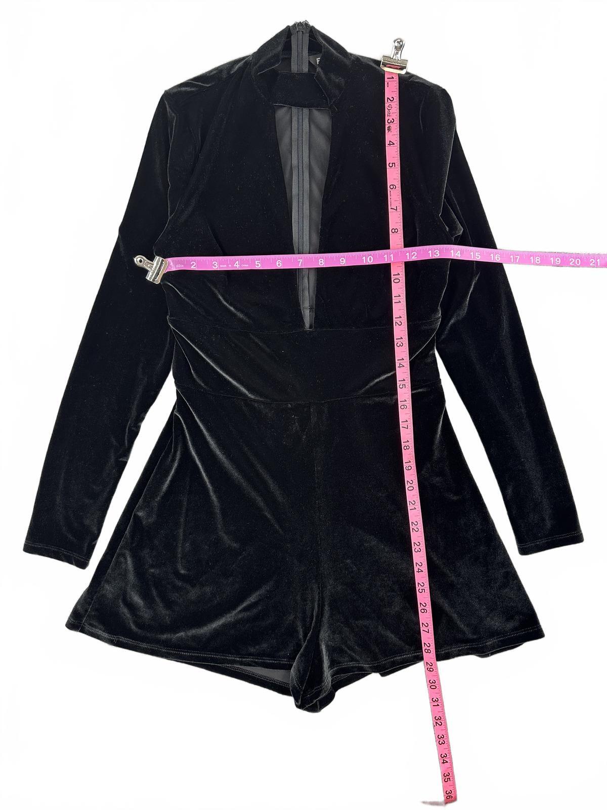 Express Black Velvet Romper with Deep V Neckline and Long Sleeves