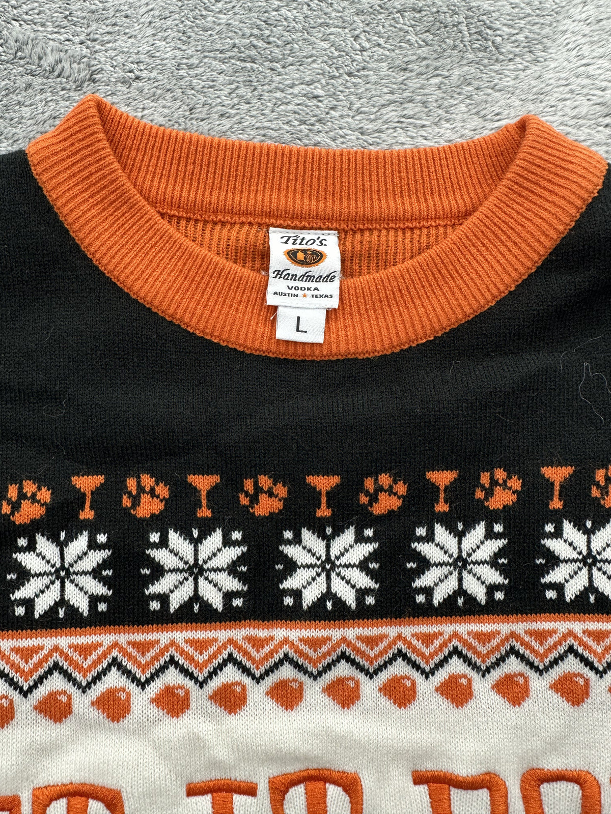 Tito's Handmade Vodka Let It Pour Holiday Sweater Black Orange Knit