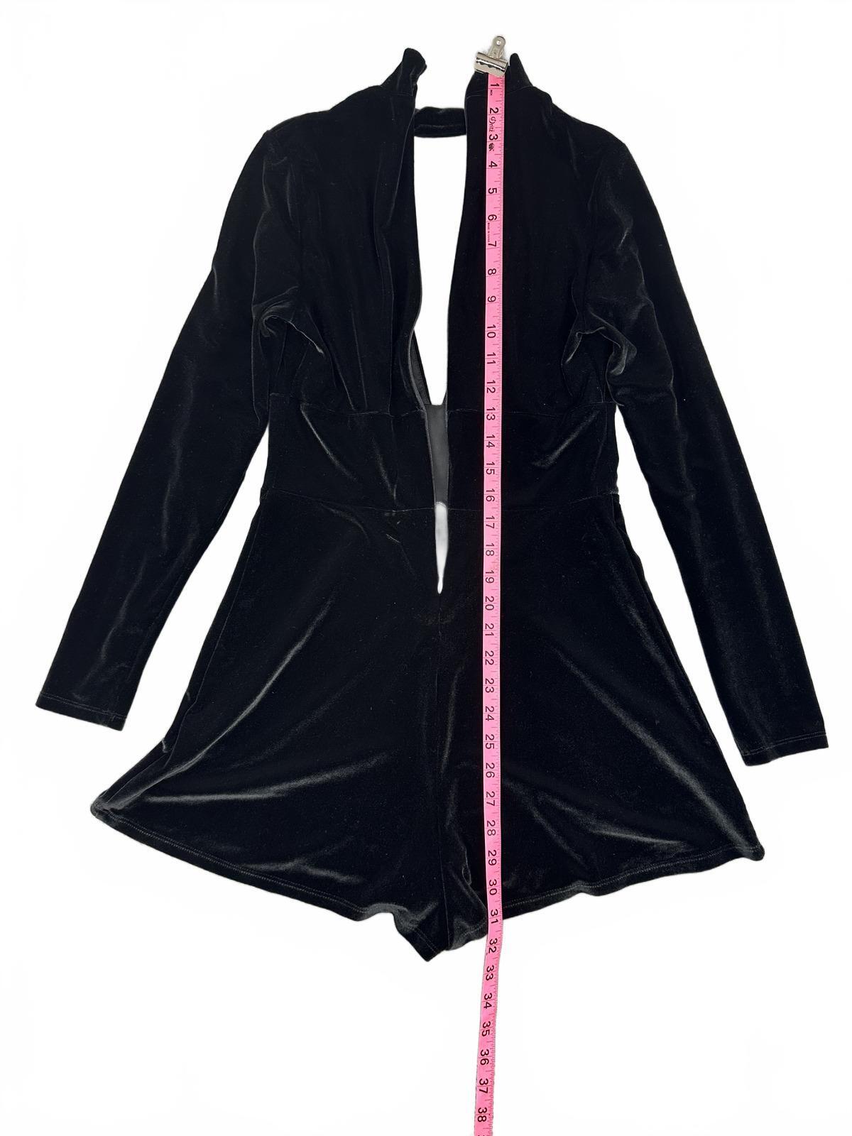 Express Black Velvet Romper with Deep V Neckline and Long Sleeves